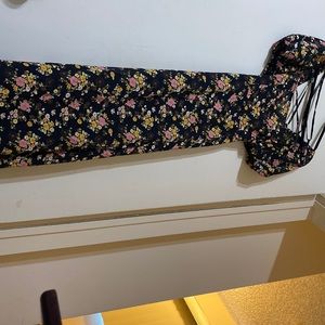 long black floral dress with a crisscross back